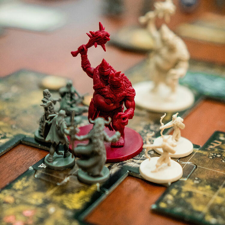Teamwork! a group of plastic mini figurines on a gaming board